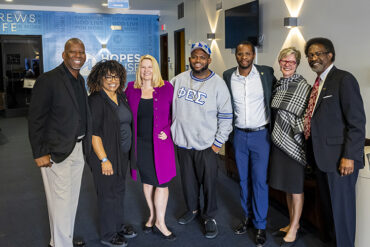 CSUN President Erika D. Beck poses with cabinet members, staff and Senior Pastor Charles Humphrey Jr.,