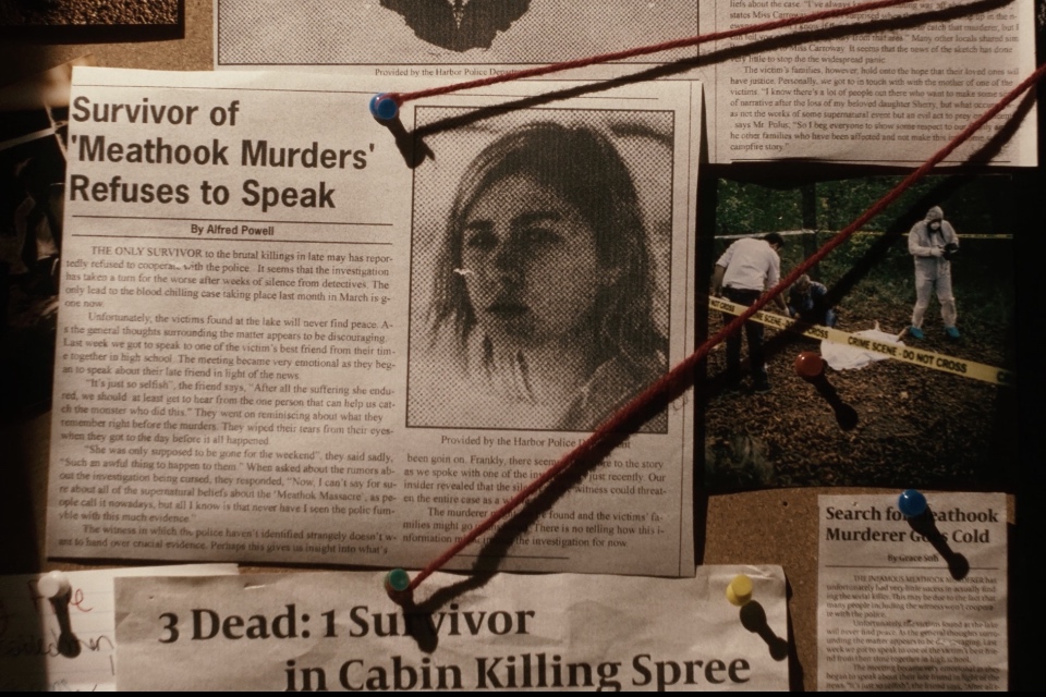 Movie still of newspaper clippings of various headlines with the main focus on the survivor of the "meathook murder" with an image of a women on the newspaper clipping