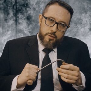 "Meathook" director, Jermey Ashley poses with a meathook for a profile shot.