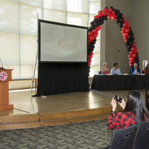 The Bull Ring stage with Steven Van Alen at podium and judges' panel.