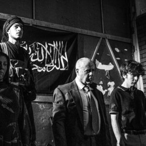 People in a line being held hostage.