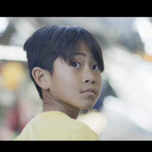 A boy turning around