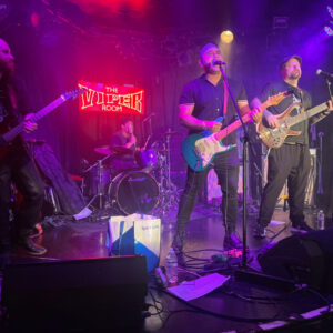 The Band, CANO, performing a song on stage at a venue called The Viper Room.
