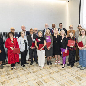 Group of faculty members pose for a photo.