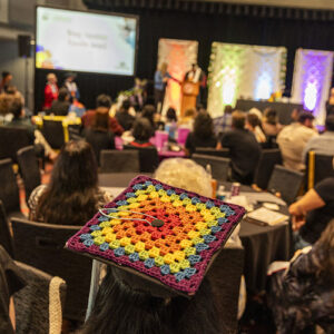 A graduate's hand-crocheted rainbow mortarboard.