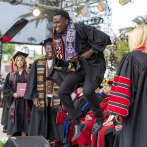 A just-graduated Matador celebrates at the David Nazarian College of Business & Economics commencement ceremony on Saturday, May 17, 2025.