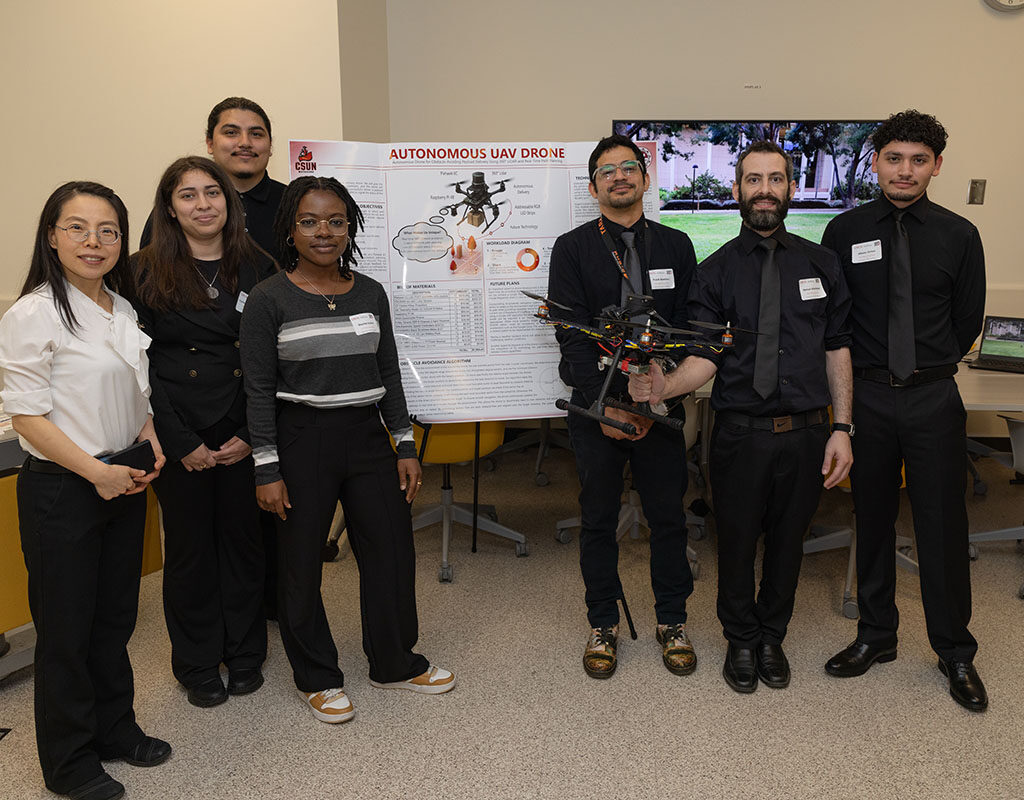 The engineering team with their drone.