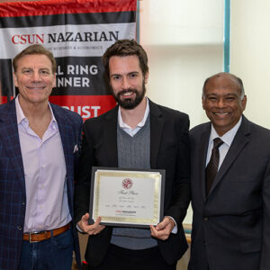 Tim Attewell poses, holding his certificate, with dean of the David Nazarian College of Business and Economics (right) and CSUN alumnus Jon Georgio '83.