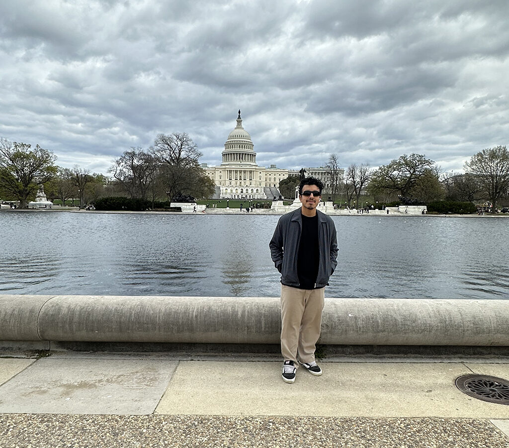CSUN student Jobany Osorio in front of the Capitol Reflecting Pool in Washington, D.C.