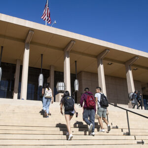 students walk up the steps of the Oviatt library