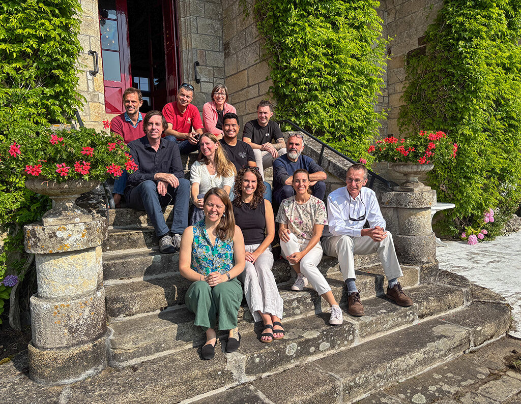 Peter Edmunds and his colleagues on the steps of Chateau de la Bretesche
