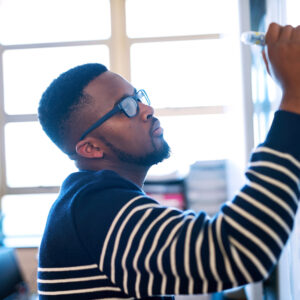Student writing on a board