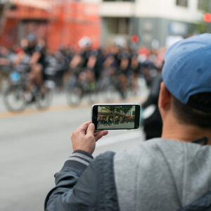 person filming with their camera