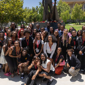Students gather together to pose for a group photo.