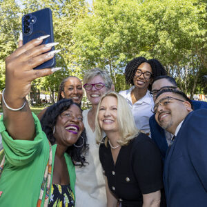 CSUN President Erika D. Beck and 5 colleagues smile for a selfie.