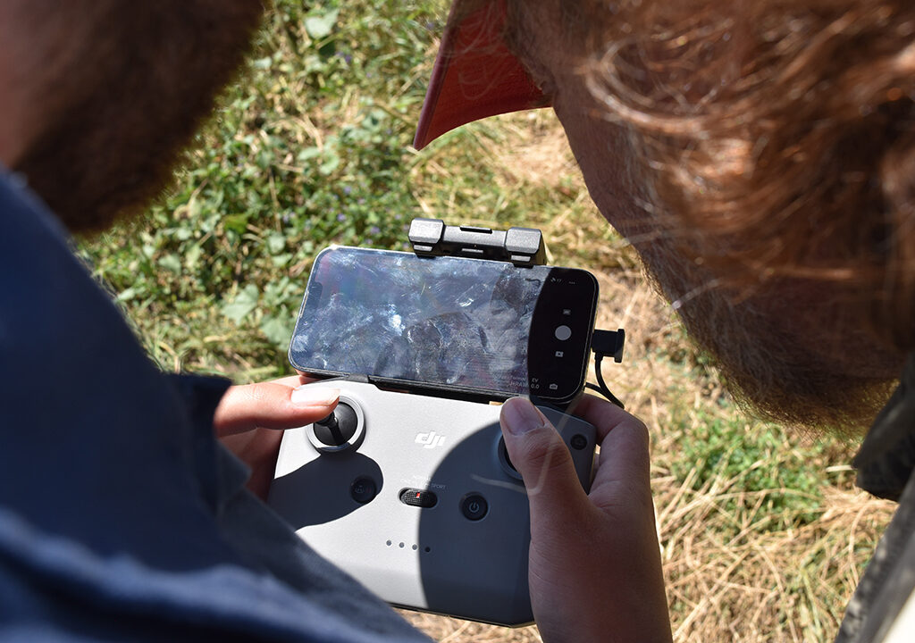 Examining footage from a drone.
