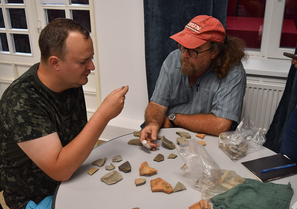 Project Director Doonan and Romanian co-Director Dr. Alexander Berzovan talking.