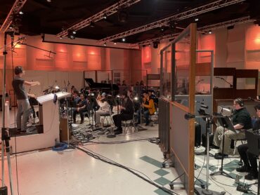 Student musicians recording music.