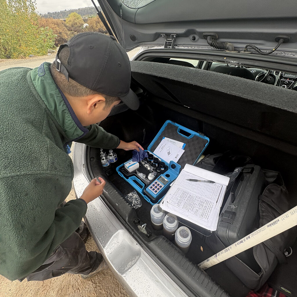 Student testing water sample