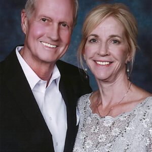Portrait of Mark and Diana Cooley, both dressed up.