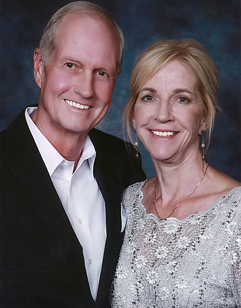 Portrait of Mark and Diana Cooley, both dressed up. 