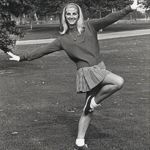 Vintage photo of CSUN alum Diana Cooley in long sleeves and a skirt.