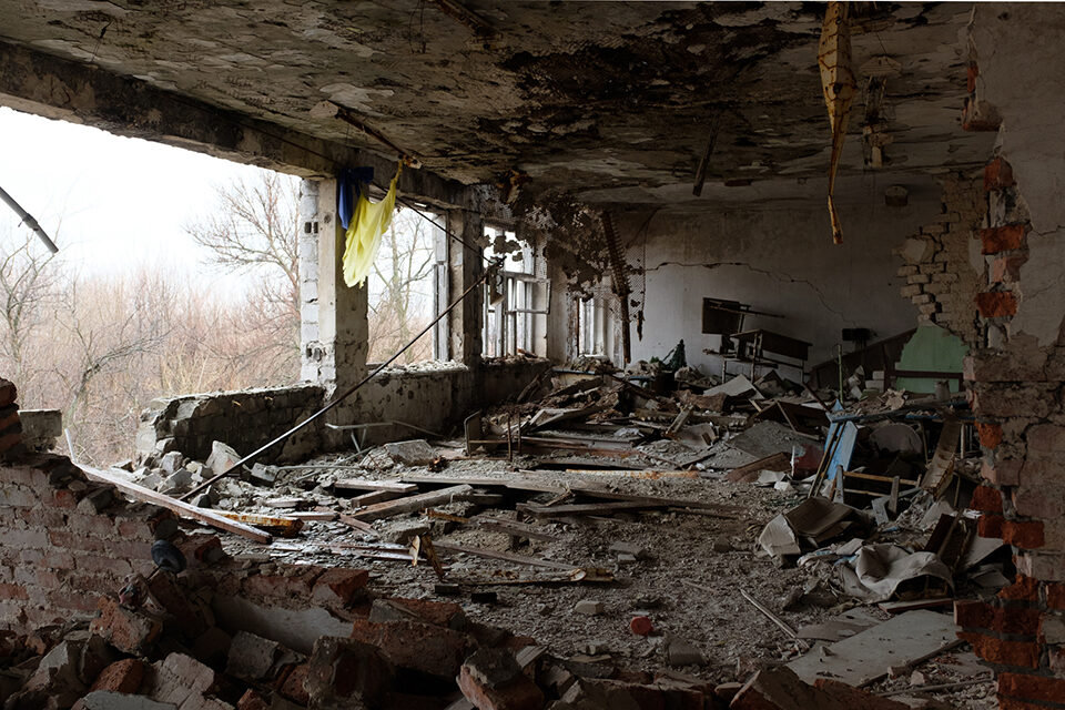 A bombed out school near Donbas, Ukraine. War can shift one’s moral compass and make committing violence against another person more acceptable, according to CSUN professor Anastasiia Timmer. Photo by Jakub Laichter, iStock