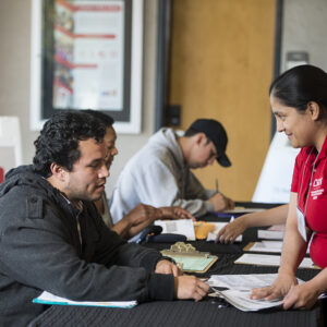 A VITA student volunteer provides in-person assistance to a taxpayer. The Wells Fargo Foundation has awarded CSUN two grants totaling $250,000 to support VITA and the Nazarian College Small Business Consulting Program. Photo by CSUN photographer..
