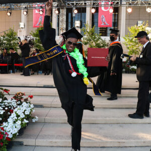 A student walking the stage after earning a degree with the support of the Equal Educational Opportunity (EOP) program at CSUN. Photo provided by the university EOP Office.