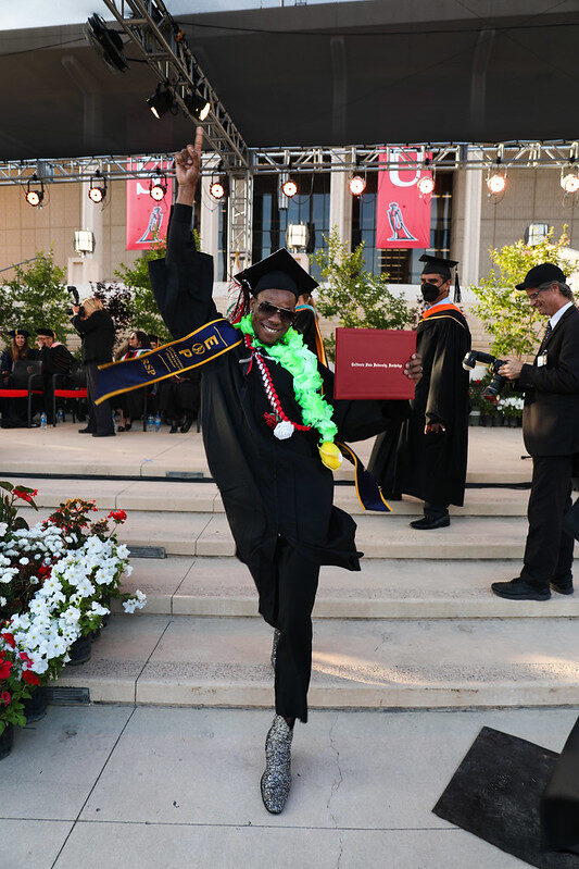 A student walking the stage after earning a degree with the support of the Equal Educational Opportunity (EOP) program at CSUN. Photo provided by the university EOP Office.