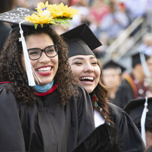 Graduates celebrate at a CSUN commencement ceremony in 2022. Thousands will be cheering later this month as more than 11,000 graduating students cross the stage in front of CSUN’s University Library as the campus celebrates its 2023 commencement. Photo by Lee Choo.