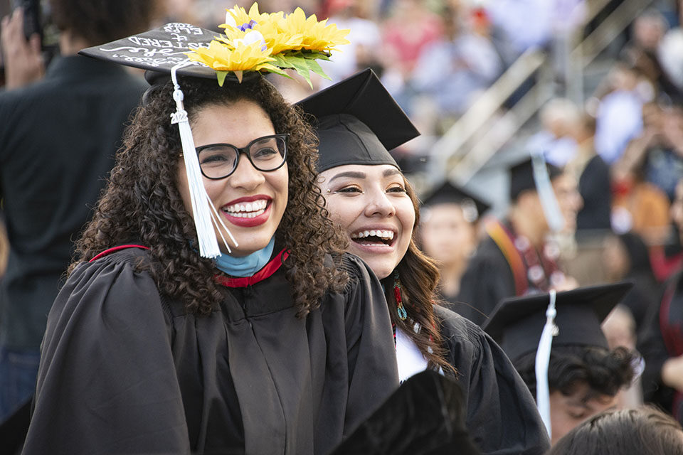 Graduates celebrate at a CSUN commencement ceremony in 2022. Thousands will be cheering later this month as more than 11,000 graduating students cross the stage in front of CSUN’s University Library as the campus celebrates its 2023 commencement. Photo by Lee Choo.