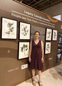 Professor Rachel Giraudo in front of a preliminary presentation of team's work, prepared for sharing at the state fair. 
