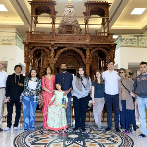 Vikas Malhotra, CSUN’s first Bhagvan Ajitnath Endowed Professorship in Jain Studies, his family (center left) and Dr. Jasvant Modi (far left) with CSUN students and their families doing a class visit to the Jain Center of Southern California. Photo courtesy of Vikas Malhotra.