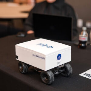 A white container on four wheels with IBM SkillsBuild written on the side.