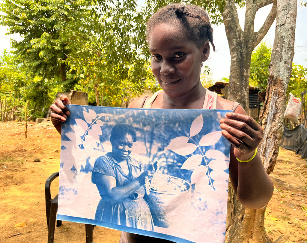 Dairy Salgado Miranda with a cyanotype of her grandmother, Celestina Obeso de Miranda. San Basilio de Palenque