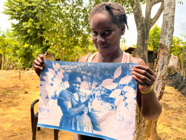 Dairy Salgado Miranda with a cyanotype of her grandmother, Celestina Obeso de Miranda. San Basilio de Palenque