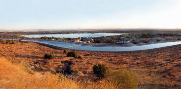 Wide shot view at sunrise light on Lake Palmdale and the adjacent California Aqueduct as seen from lookout along California State Route 14.