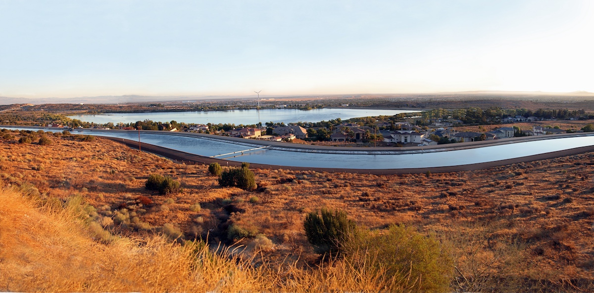 Wide shot view at sunrise light on Lake Palmdale and the adjacent California Aqueduct as seen from lookout along California State Route 14.