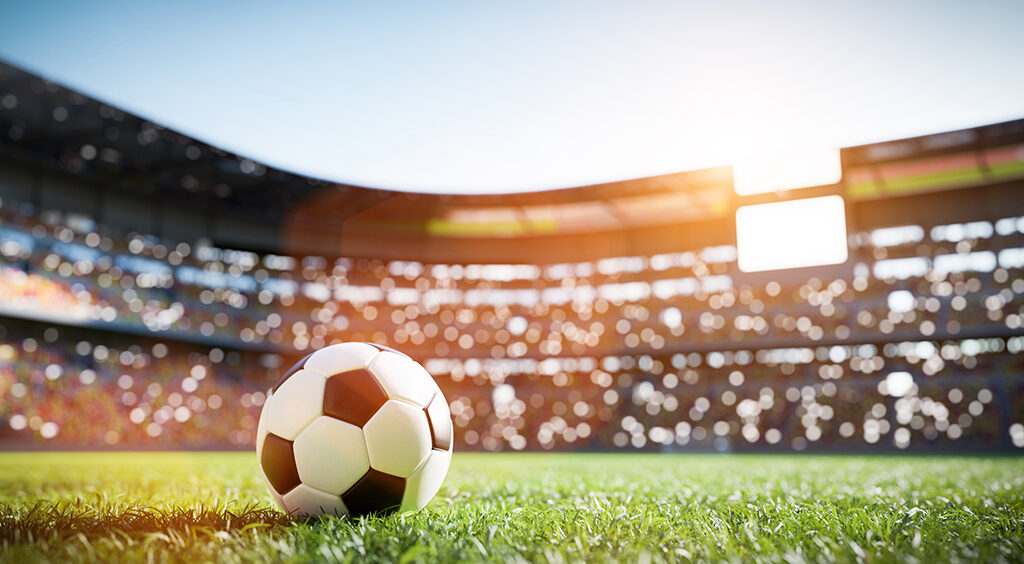 Soccer ball on grass field on stadium
