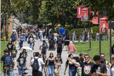 Students walk on campus sidewalks during first week of fall classes.