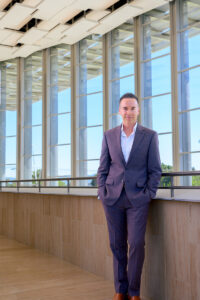Chag Hilligus, executive and artistic director of The Soraya, leans against a balcony inside The Soraya.