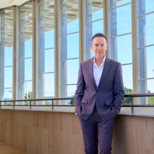 Chag Hilligus, executive and artistic director of The Soraya, leans against a balcony inside The Soraya.