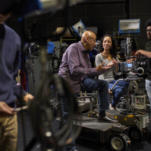 Nate Thomas working with film students