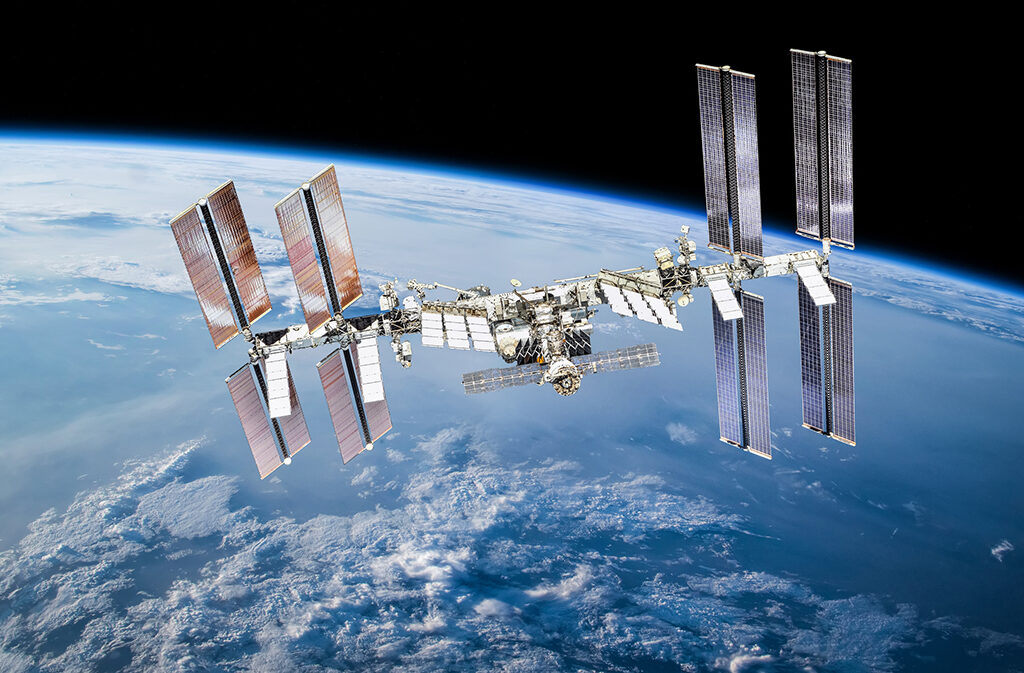 International space station with astronauts. Elements of this image furnished by NASA (url:https://www.nasa.gov/sites/default/files/thumbnails/image/iss060e007297.jpg https://www.nasa.gov/sites/default/files/thumbnails/image/44911459904_375bc02163_k.jpg)