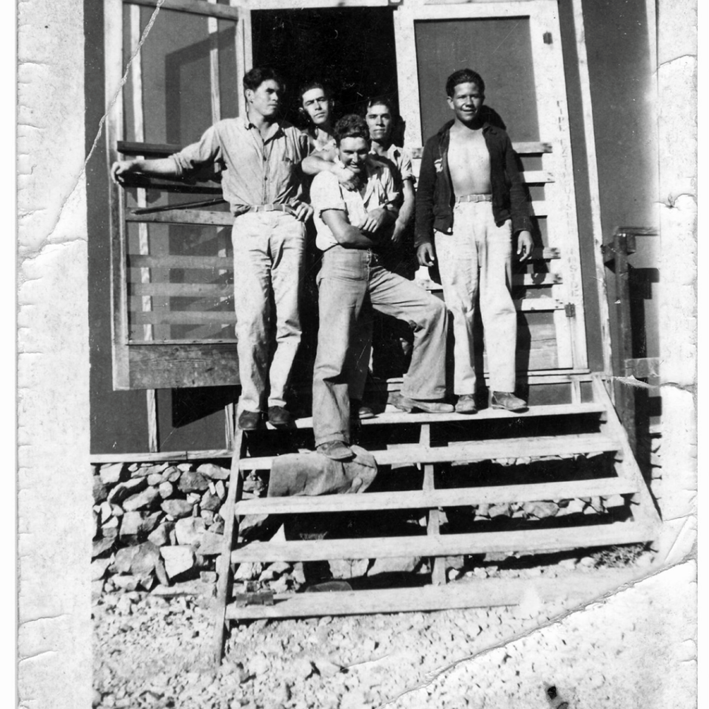 “Five Chicano enrollees standing outside doorway in CCC camp, January 23, 1934. Courtesy of Marfa Public Library, Marfa, Texas.